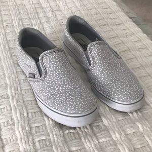 Grey and white polka dot slip on Van tennis shoes